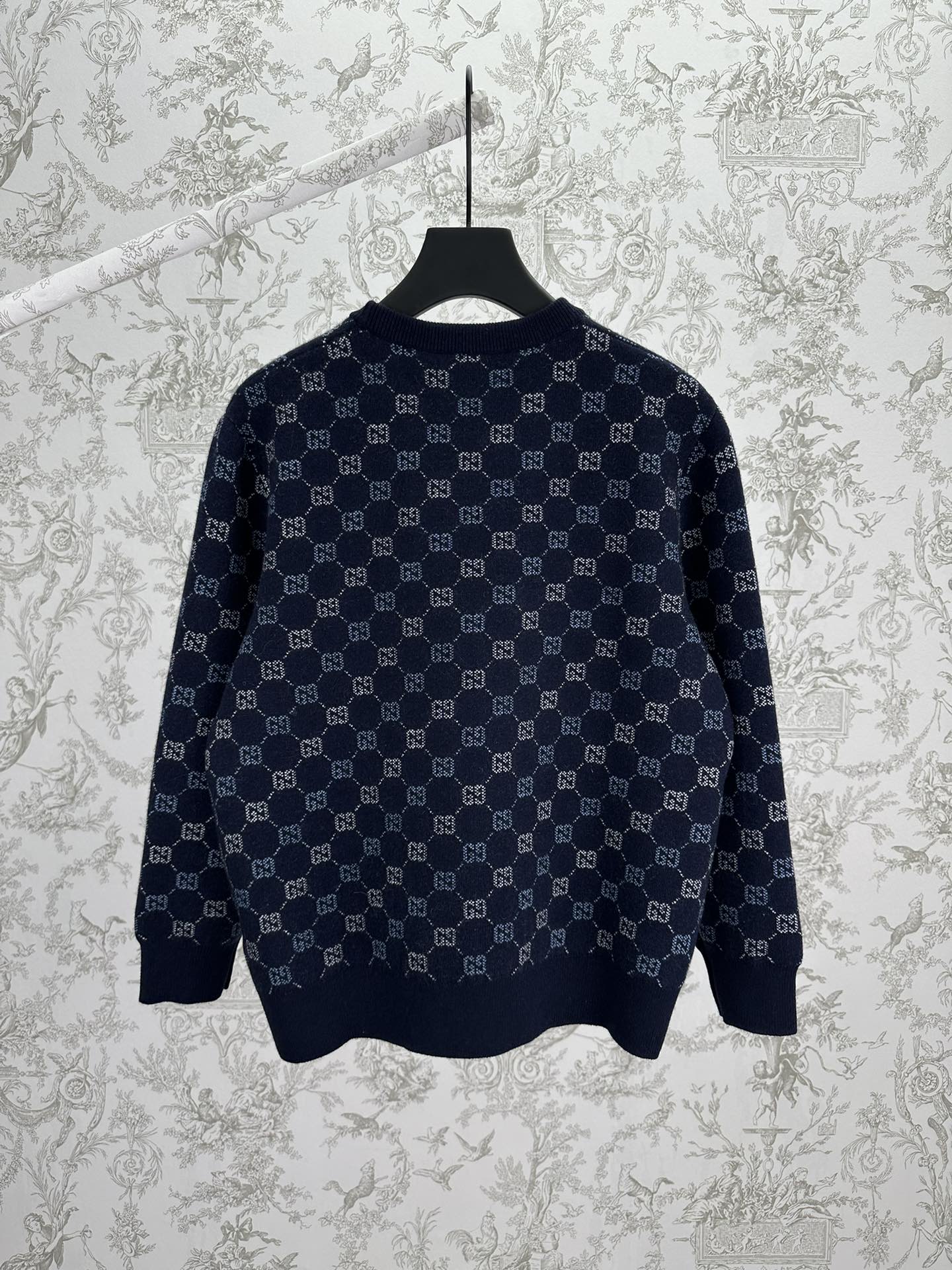 Navy long-sleeve sweater featuring an allover GG monogram knit pattern