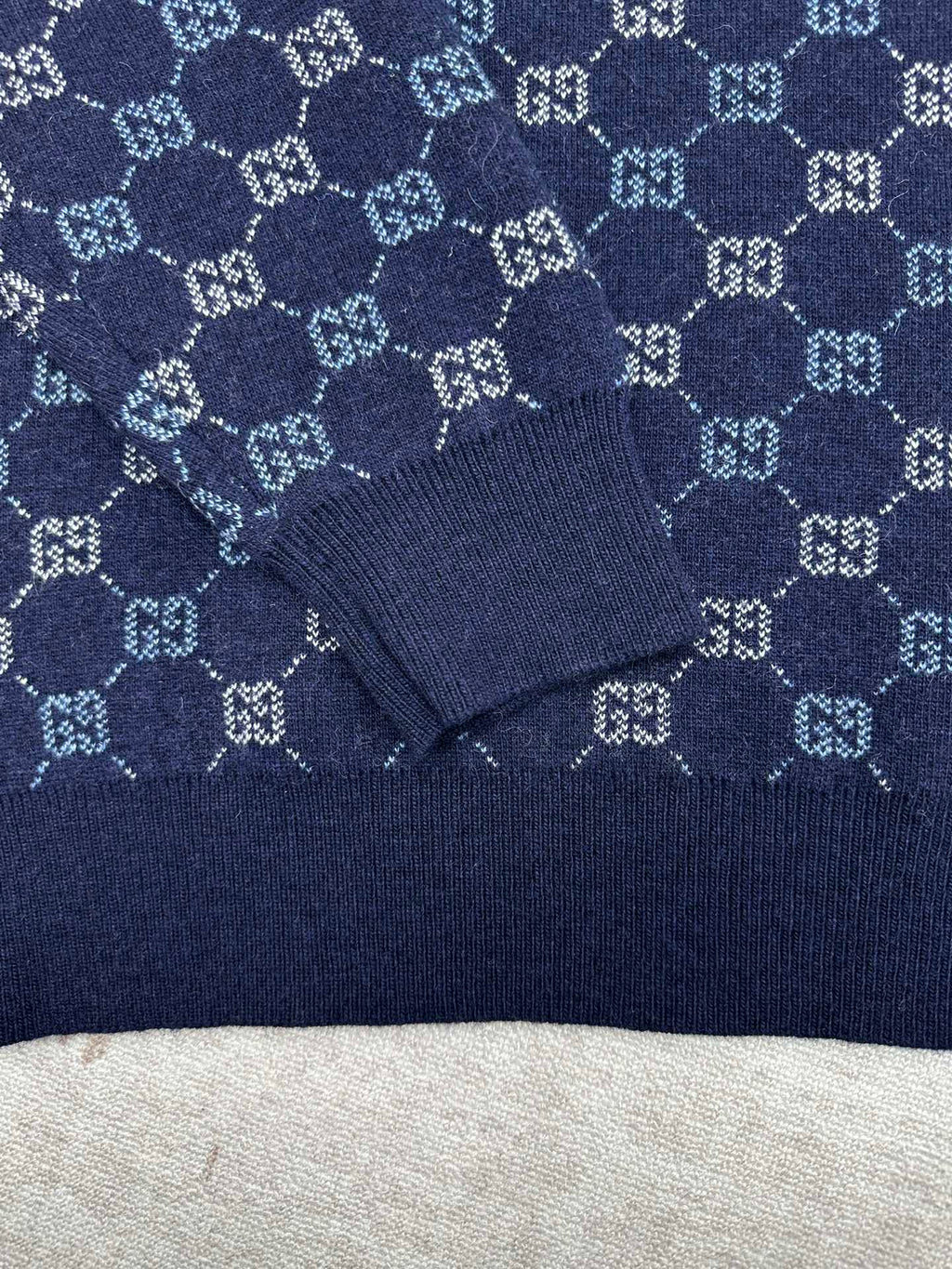 Navy long-sleeve sweater with GG monogram knit pattern and ribbed collar