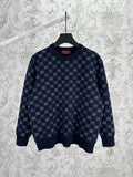 Navy long-sleeve knit sweater with allover GG monogram pattern and ribbed hem