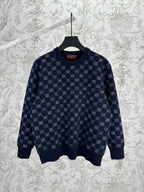 Navy long-sleeve knit sweater with allover GG monogram pattern and ribbed hem