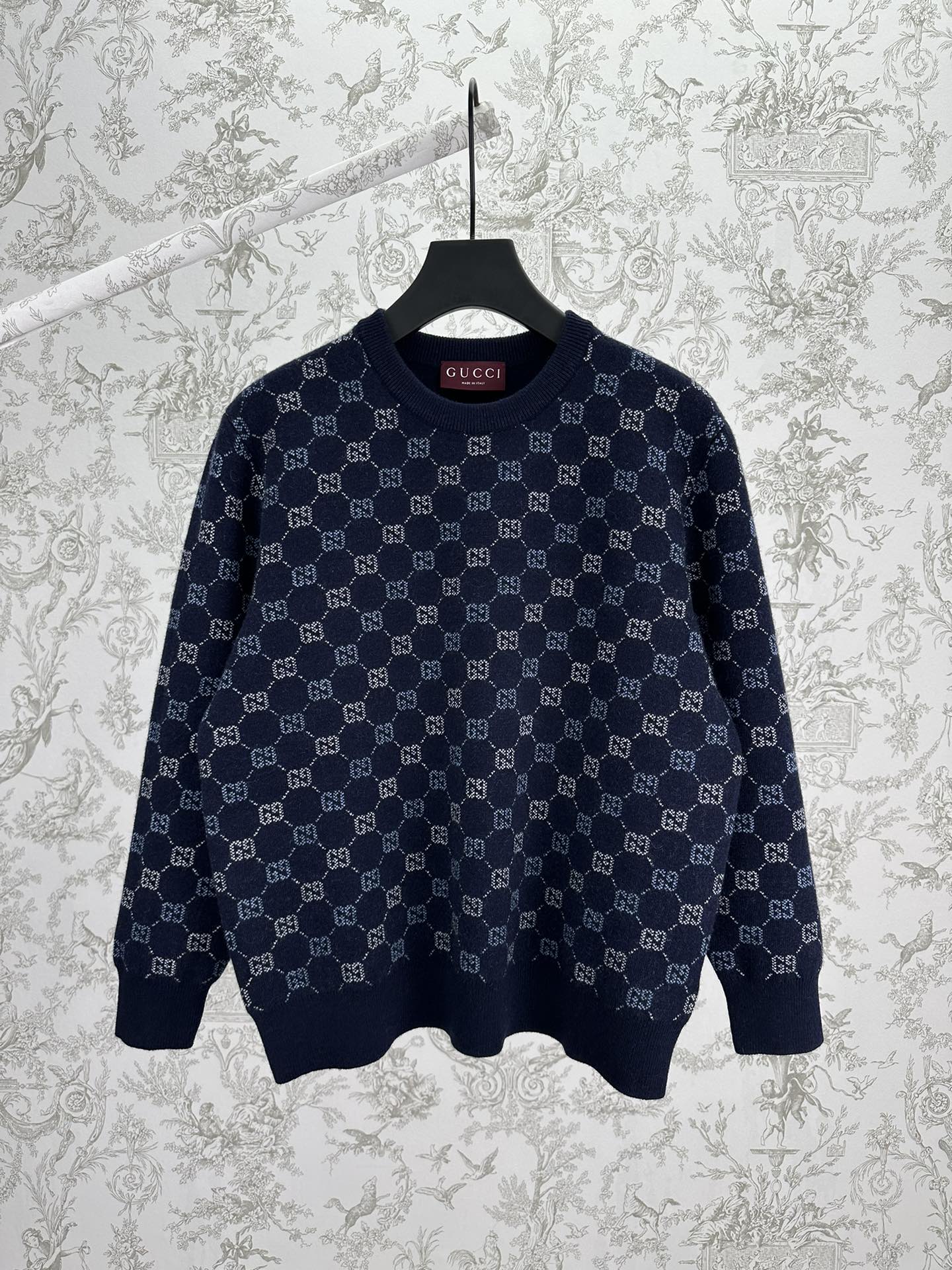 Navy long-sleeve knit sweater with allover GG monogram pattern and ribbed hem