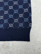 Navy knit sweater cuff with GG monogram pattern and solid ribbed hem