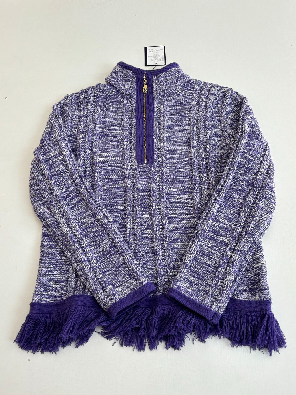 Knit quarter-zip sweater with deep purple zipper trim and heathered blue textured body