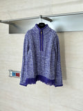 Long-sleeve knit quarter-zip sweater in heathered blue with purple fringe hem and cuffs