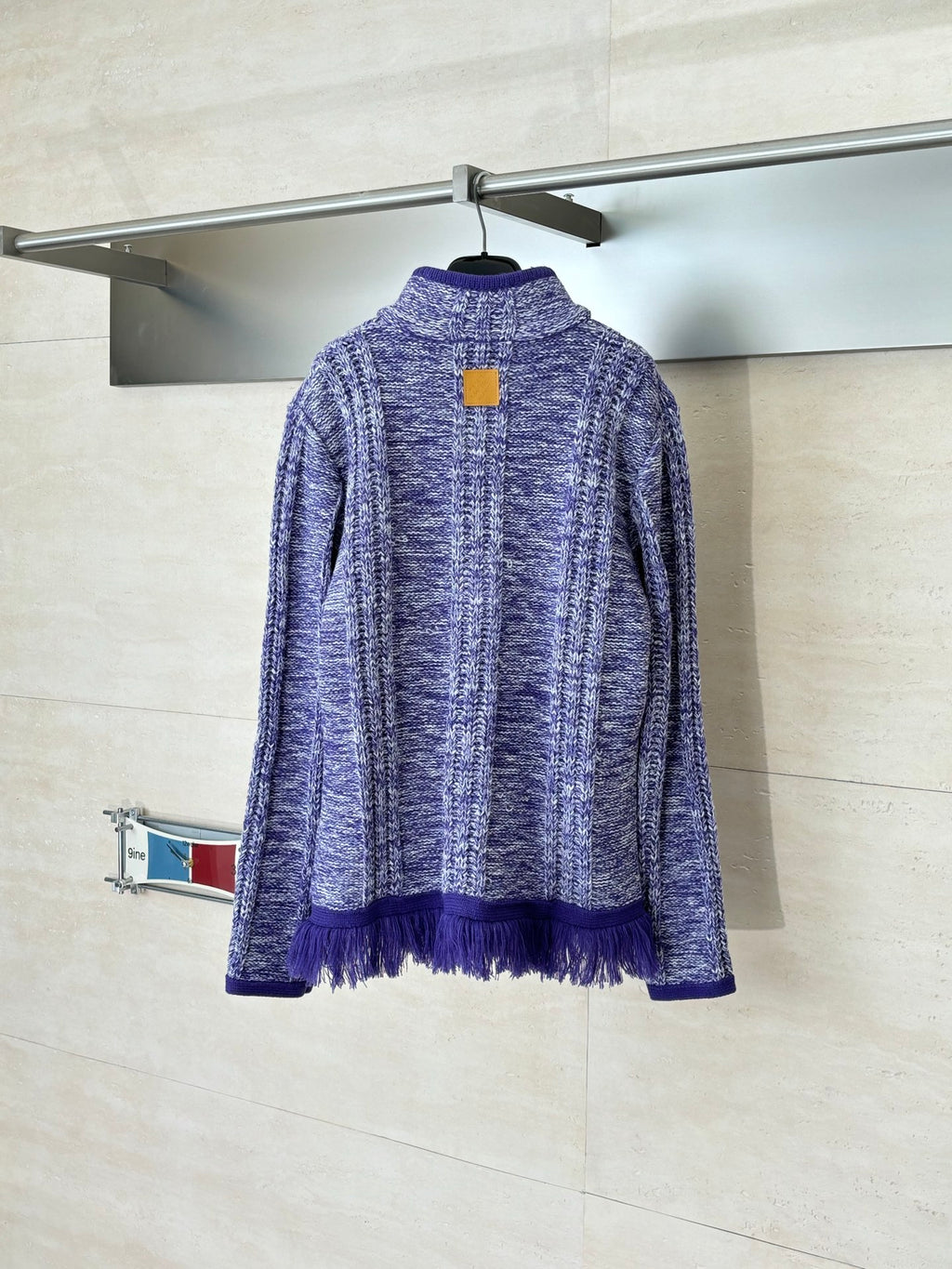 Long-sleeve knit quarter-zip sweater back view, heathered blue with purple fringe hem