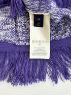 Knit sweater label area with size tag, heathered blue fabric and purple fringe hem