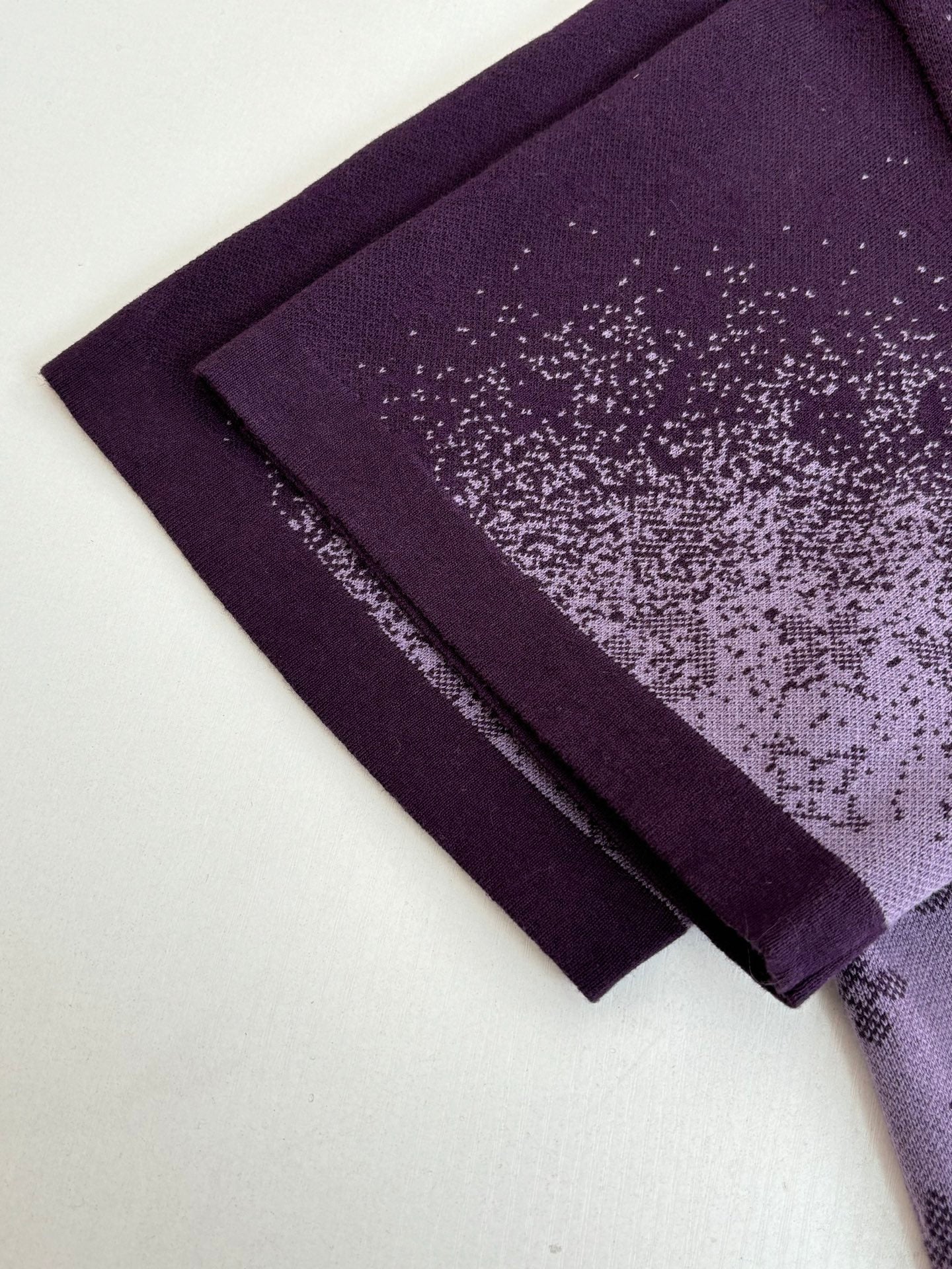 Purple T-shirt hem and sleeve edge detail, folded