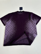 Purple T-shirt with monogram-style allover print, laid flat