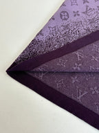 Purple T-shirt fabric and seam detail near hem