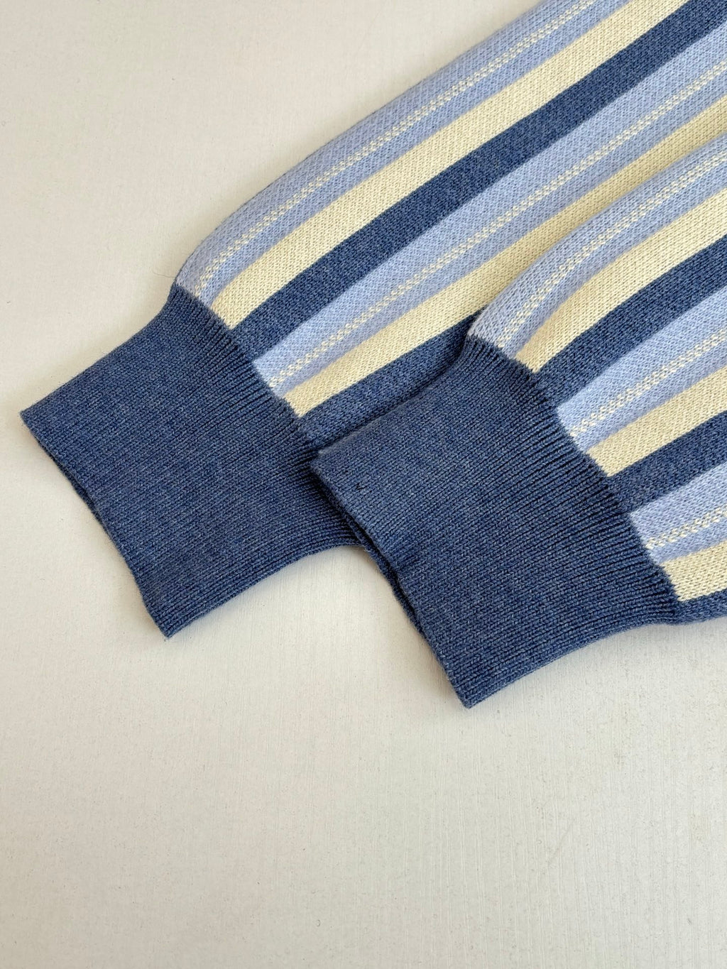 Louis Vuitton striped cardigan cuffs and sleeve ends, blue ribbed knit with motif