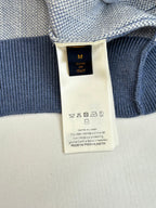 Ribbed knit long-sleeve top with size label and care icons
