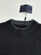 Dark knit crew-neck sweater with ribbed neckline and collar texture