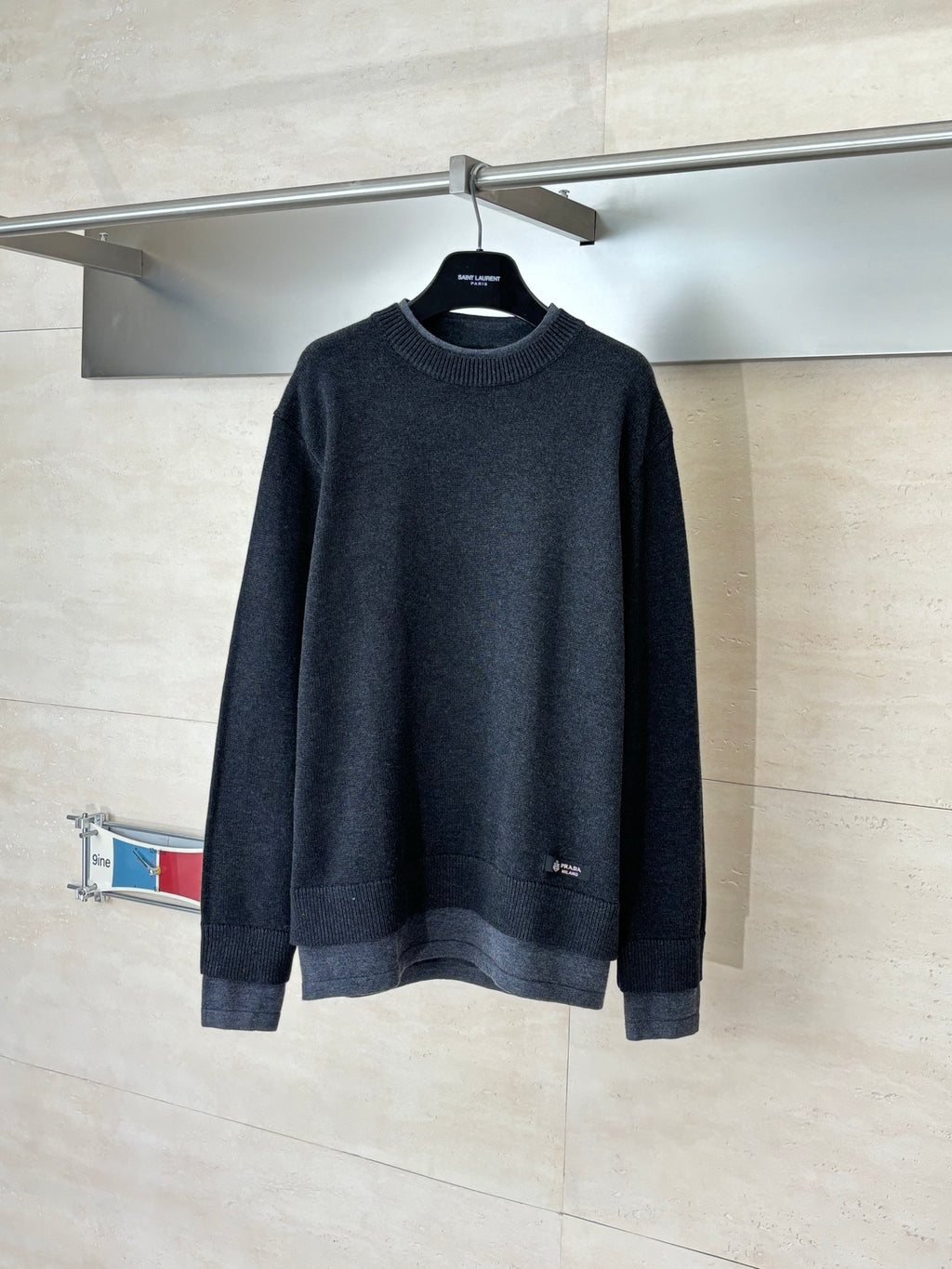 Dark navy long-sleeve sweater with ribbed crew neck and cuffs