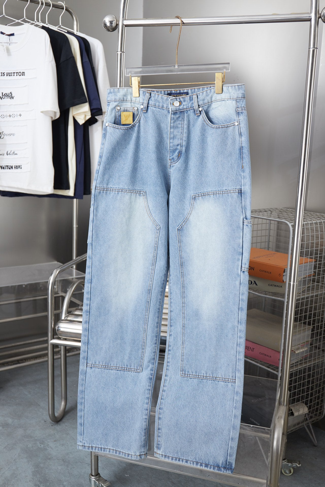 Light blue denim pants with patch pockets and belt loops