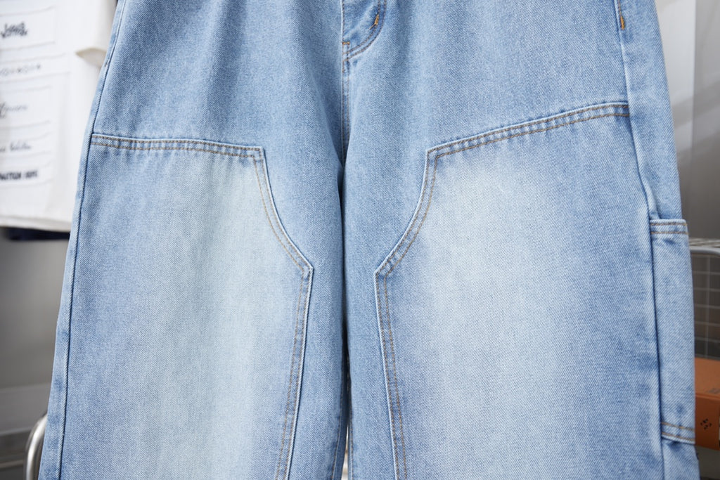 Light blue denim pants showing large front patch pockets