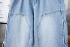 Light blue denim pants showing large front patch pockets