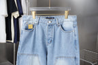 Light blue denim pants front view with button waistband and patch pockets