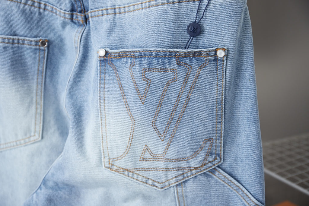 Light blue denim pants close-up of embroidered back pocket