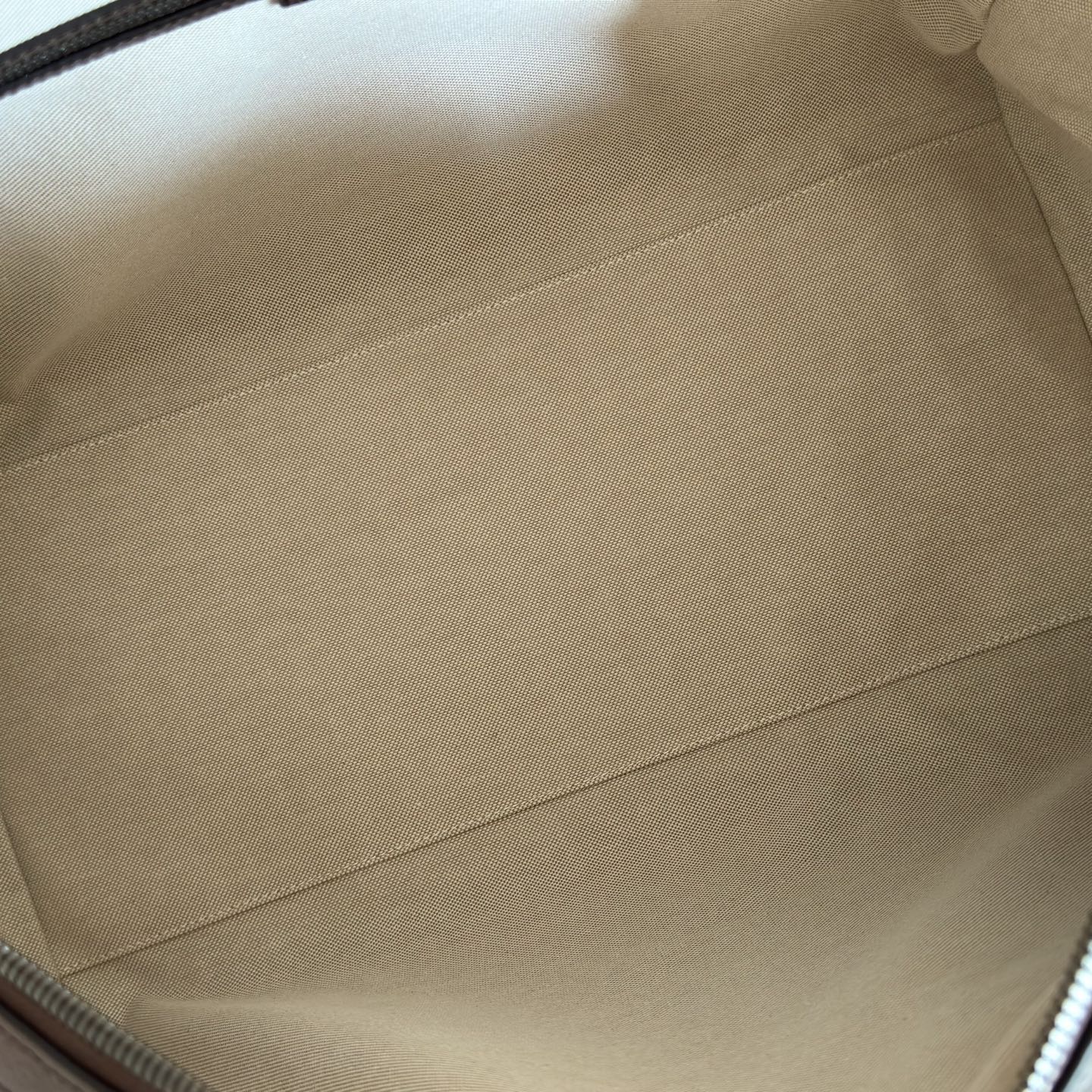 Gucci bag interior lining in light beige with stitched seam