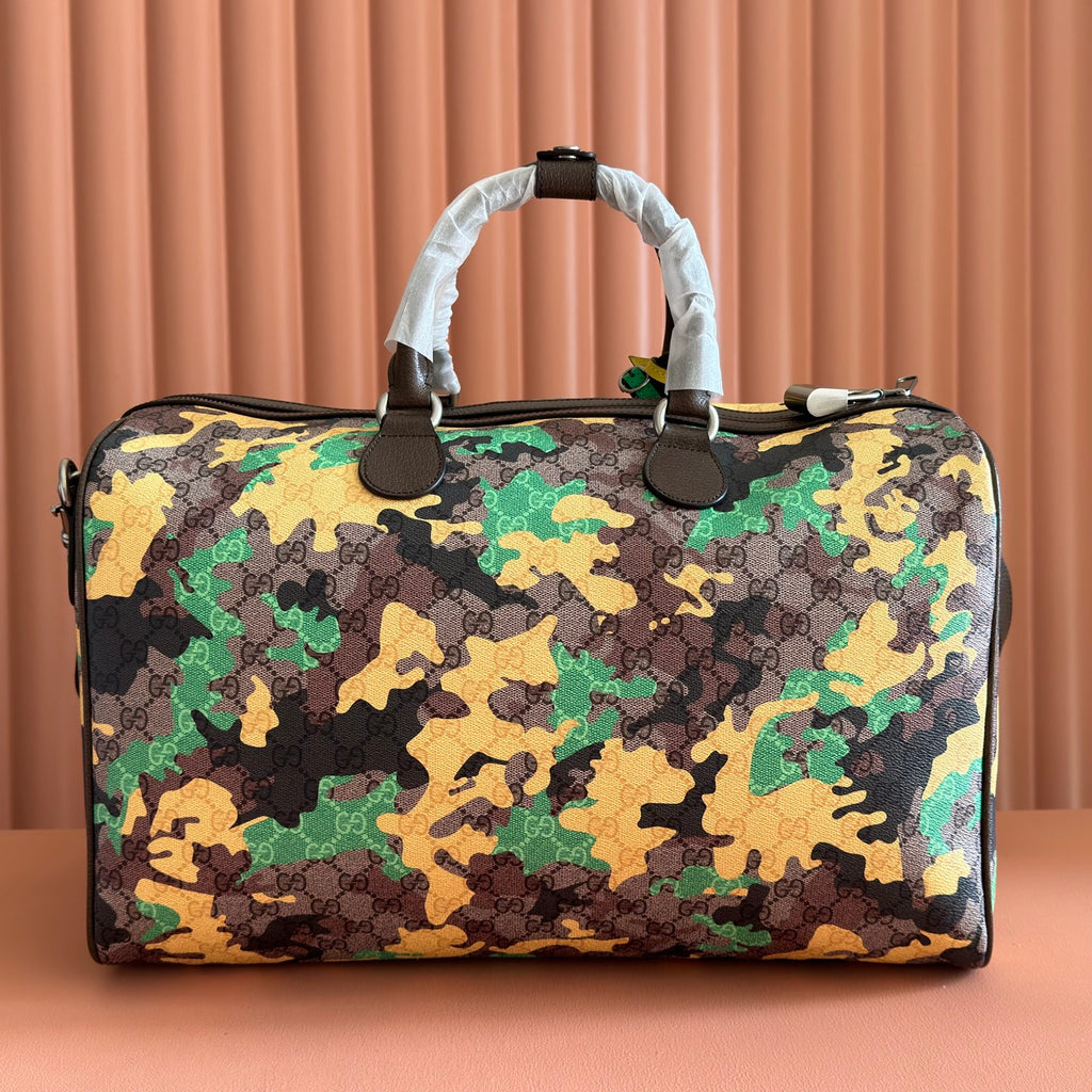 Gucci bag with camo pattern, top handles, and front view with dark leather trim