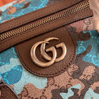 Duﬀel bag close-up of brown zipper trim and round metal logo pull tab