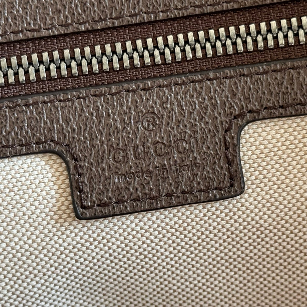 Gucci duffel bag interior label patch and zipper track on textured lining