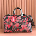 Gucci duffel bag with red and black camo GG print, top handles, leather trim