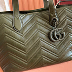 Olive green quilted leather tote with chevron stitching and GG ring charm