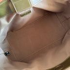 Brown fabric bag interior with stitched seam and interior open pocket