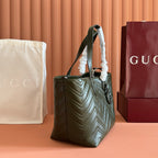 Olive green quilted leather shoulder tote bag with hanging strap and pouch