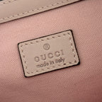 Gucci made in Italy label patch on pink interior lining, stitched border.