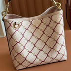 Gucci mini handbag front with beige-red lattice pattern and gold-tone buckle detail