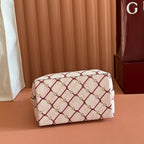 Gucci mini handbag in beige with red lattice print and structured top, front view
