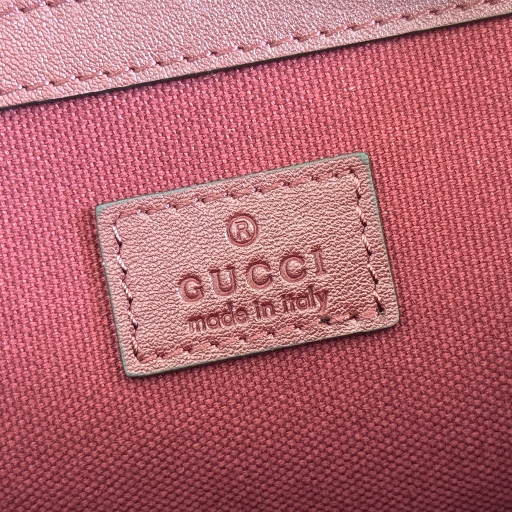 Gucci bag label patch: light pink with GUCCI and made in Italy text