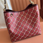 Gucci tote bag with burgundy lattice pattern, curved handles and gold hardware
