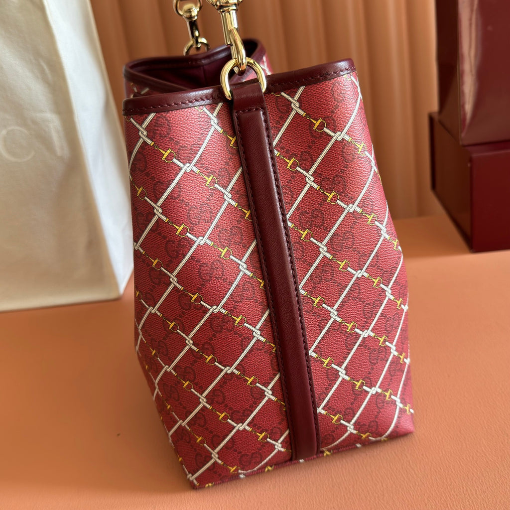 Gucci bag with burgundy lattice print, front seam and top handles