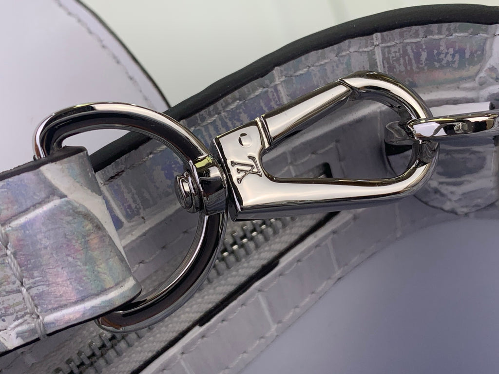 Louis Vuitton hardware clasp with rings on iridescent white croc-embossed strap
