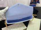 Louis Vuitton crossbody bag with light blue flap and white blue monogram front, gold chain