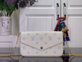 Louis Vuitton crossbody bag with white leather and blue monogram pattern, gold chain strap