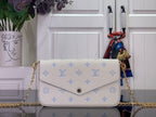 Louis Vuitton crossbody bag with white leather and blue monogram pattern, gold chain strap