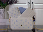 Louis Vuitton crossbody bag in white with blue monogram, flap open showing light blue lining
