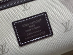 Louis Vuitton fabric label patch with dark border on beige interior trim