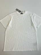Dior white short-sleeve knit top close-up with crew neck and raised textured pattern