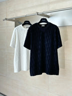 Short-sleeve knit top on hanger, dark textured logo knit; crew neckline