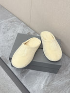 Balenciaga cream slide sandals pair with front logo on the upper
