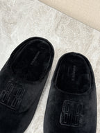 Black velvet slide sandals with embossed Balenciaga logo detail, close-up