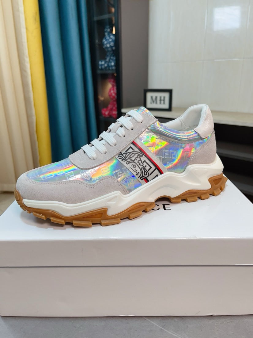 Light gray/white lace-up sneakers with iridescent print, chunky rubber sole.