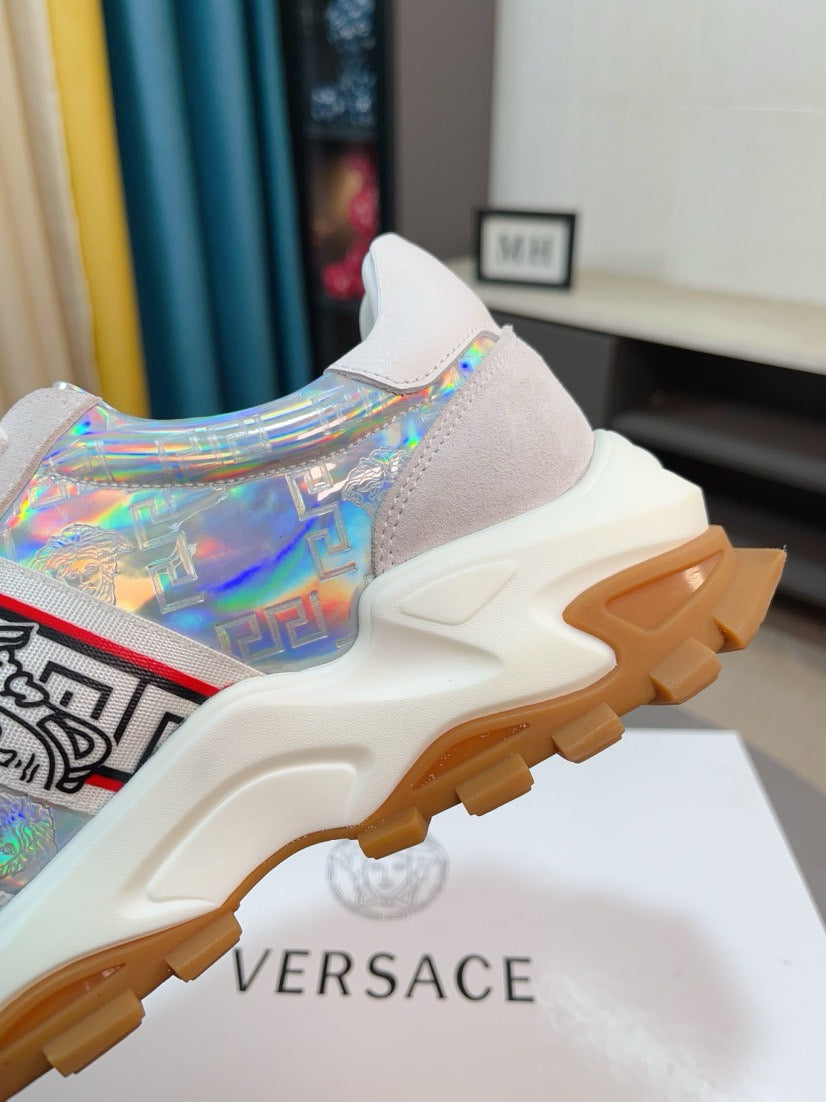 Iridescent lace-up sneakers with thick rubber sole and heel branding panel.