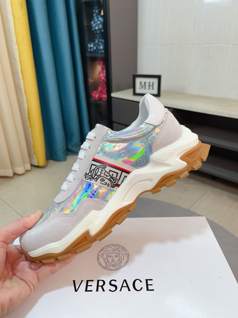 White/gray lace-up sneakers with iridescent hologram upper, thick rubber sole.