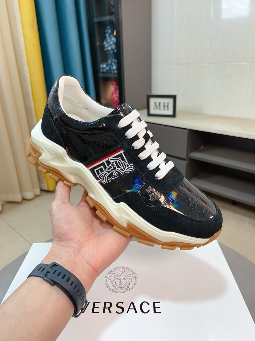 Versace lace-up sneaker, black glossy panels, white laces, tan outsole